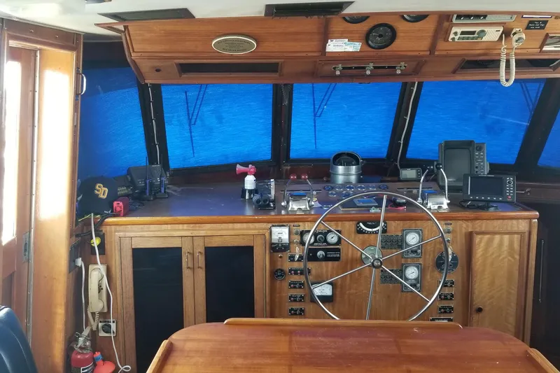 Slide: The Image of Bathroom interior of 1976 Hatteras 48 Long Range Cruiser with toiletries and window. - 56