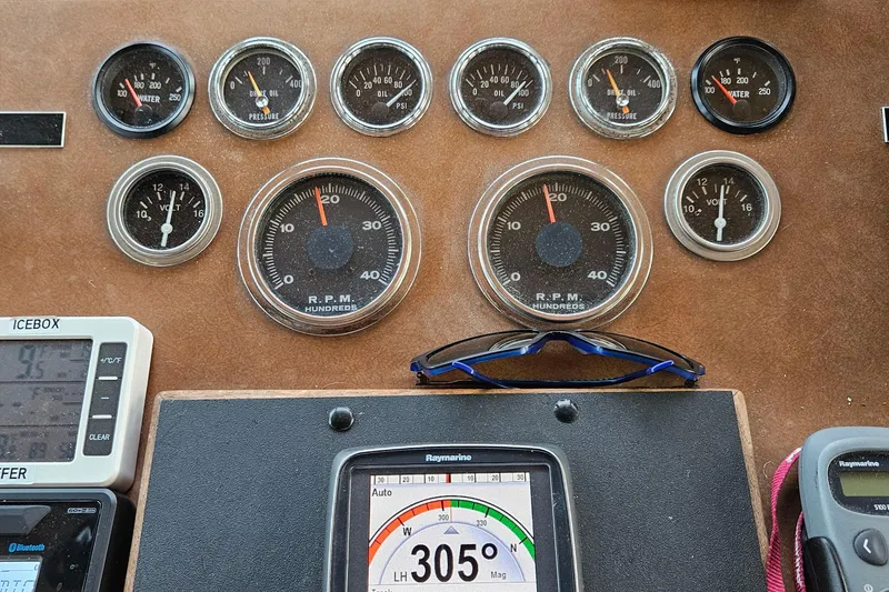 Slide: The Image of Interior of 1976 Hatteras 48 Long Range Cruiser with wood paneling and storage. - 58