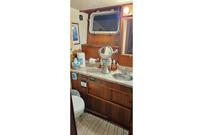 Slide: The Image of Victron Energy display on 1976 Hatteras 48 Long Range Cruiser showing power status. - 70