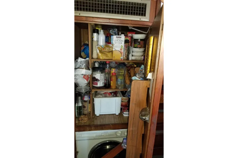 Slide: The Image of Victron Energy display showing battery and water levels on 1976 Hatteras 48 Long Range Cruiser. - 71