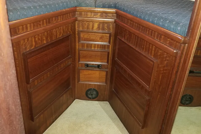 Slide: The Image of 1976 Hatteras 48 Long Range Cruiser hull on dry dock, showcasing propeller and rudder. - 76