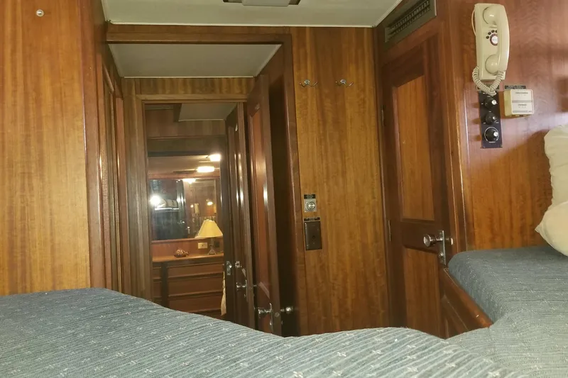 Slide: The Image of 1976 Hatteras 48 Long Range Cruiser hull on dry dock, showcasing propeller and rudder. - 79