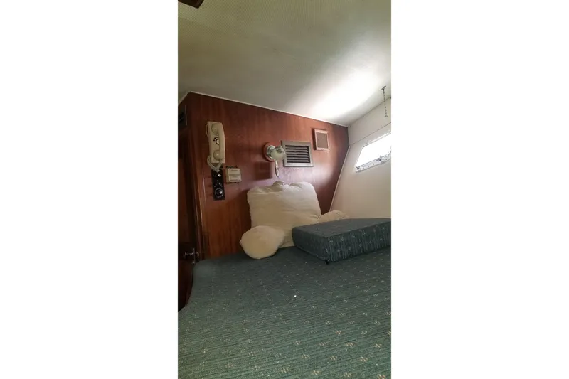 Slide: The Image of 1976 Hatteras 48 Long Range Cruiser undergoing maintenance on dry dock. - 80