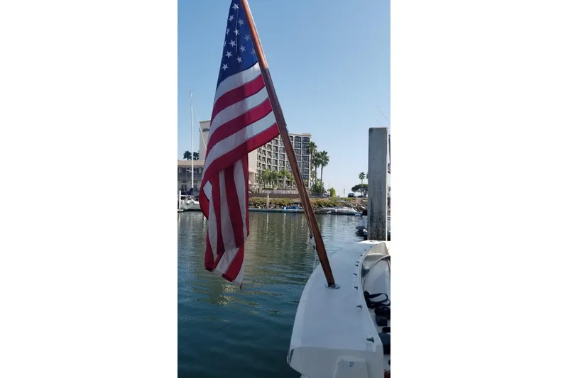 Slide: The Image of Helm of 1976 Hatteras 48 Long Range Cruiser with steering wheel and controls. - 9