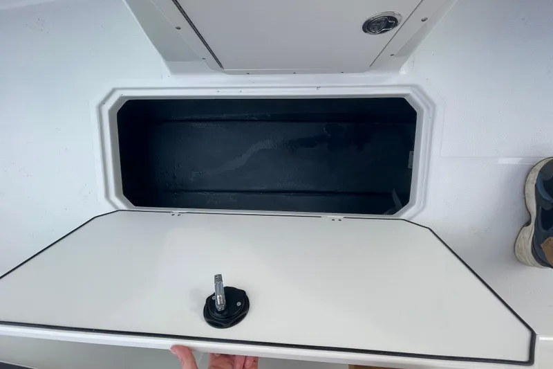 Slide: The Image of Open storage compartment on 2026 Starcraft SVX 191 OB boat deck. - 16