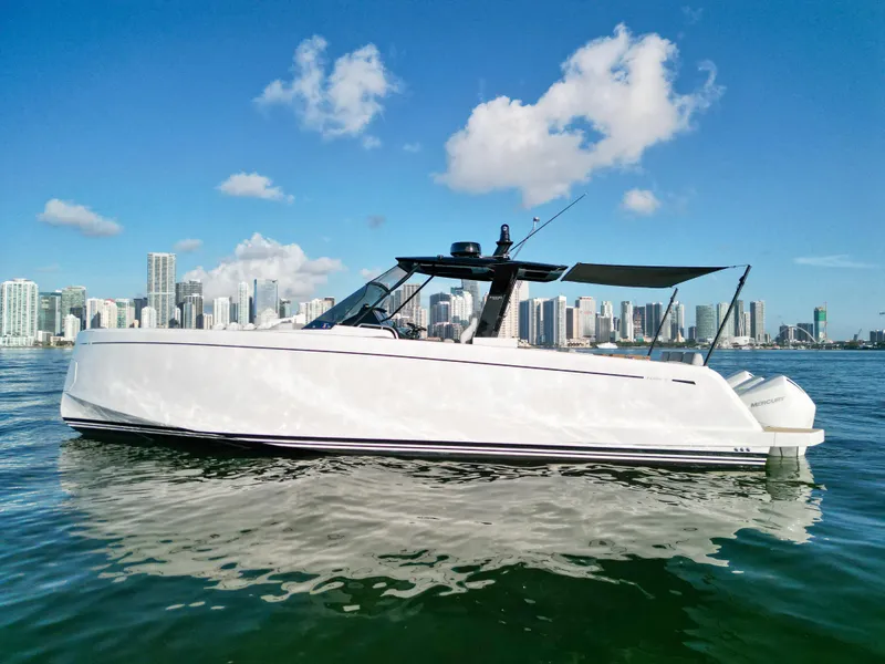 The Image of 2022 Pardo Yachts 38 cruising on water with city skyline backdrop. - 0