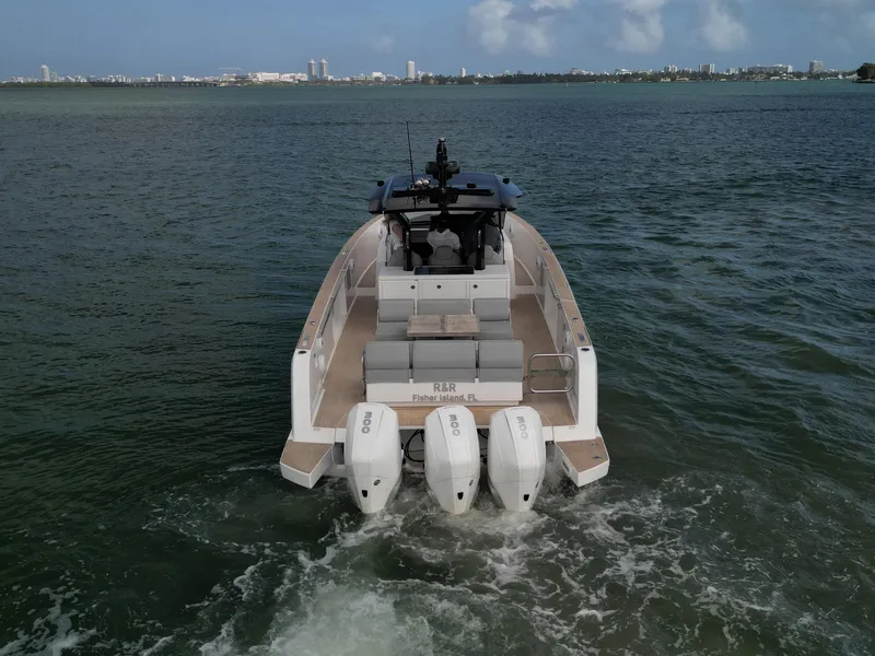 Slide: The Image of 2022 Pardo Yachts 38 cruising on open water with triple outboard engines. - 20