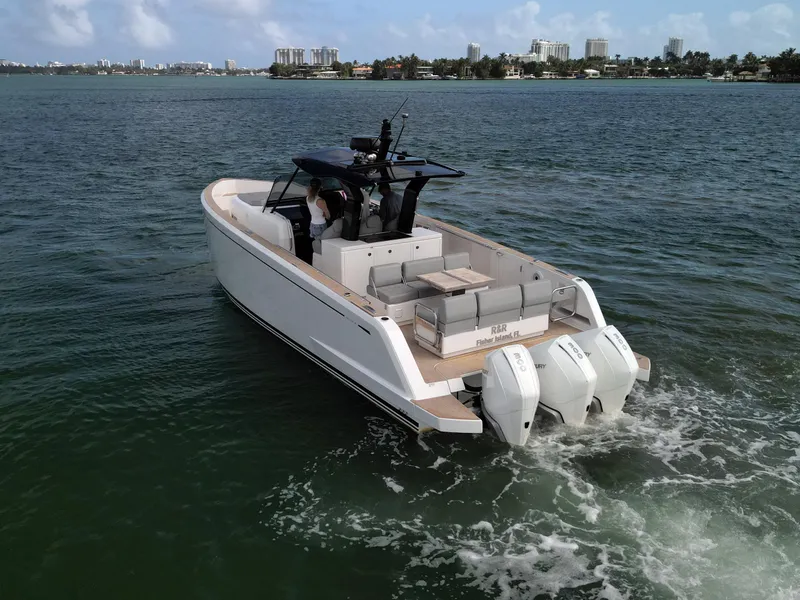 Slide: The Image of 2022 Pardo Yachts 38 cruising on water with triple outboard engines. - 22