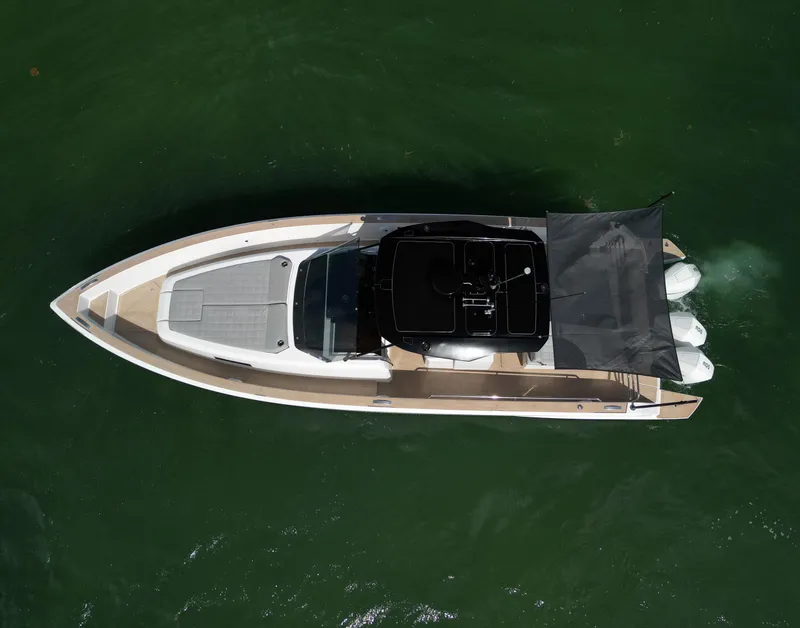 Slide: The Image of Overhead view of 2022 Pardo Yachts 38 on green water. - 26