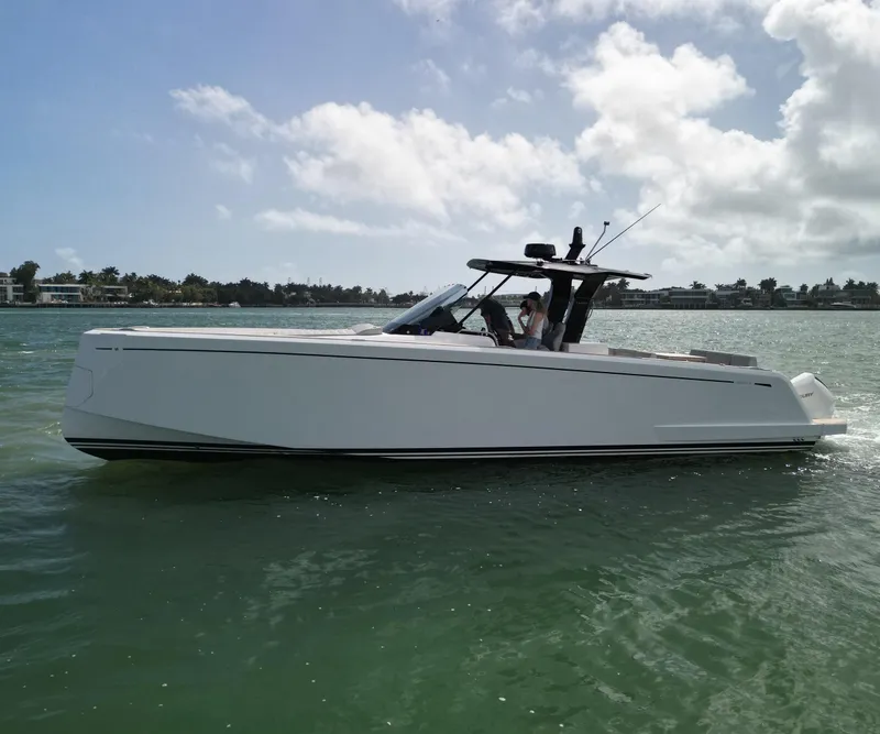 Slide: The Image of 2022 Pardo Yachts 38 cruising on calm waters under a partly cloudy sky. - 29