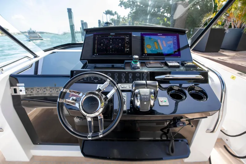 Slide: The Image of Helm of 2022 Pardo Yachts 38 with modern navigation displays and controls. - 3