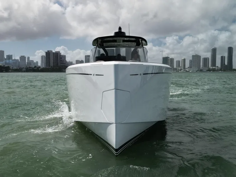 Slide: The Image of Pardo Yachts 38, 2022 model, cruising in urban waters with city skyline backdrop. - 31