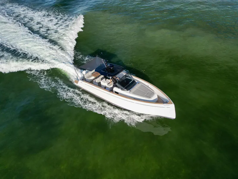 Slide: The Image of 2022 Pardo Yachts 38 cruising on clear green water, aerial view. - 4