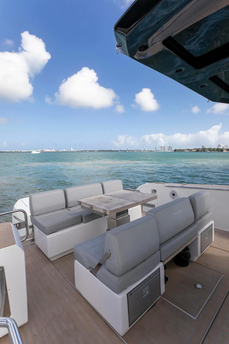 Slide: The Image of 2022 Pardo Yachts 38 with elegant seating, ocean view, and clear blue sky. - 45