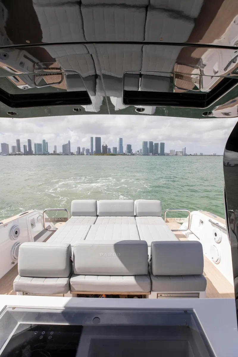 Slide: The Image of 2022 Pardo Yachts 38 with city skyline view, featuring luxurious seating and sleek design. - 46