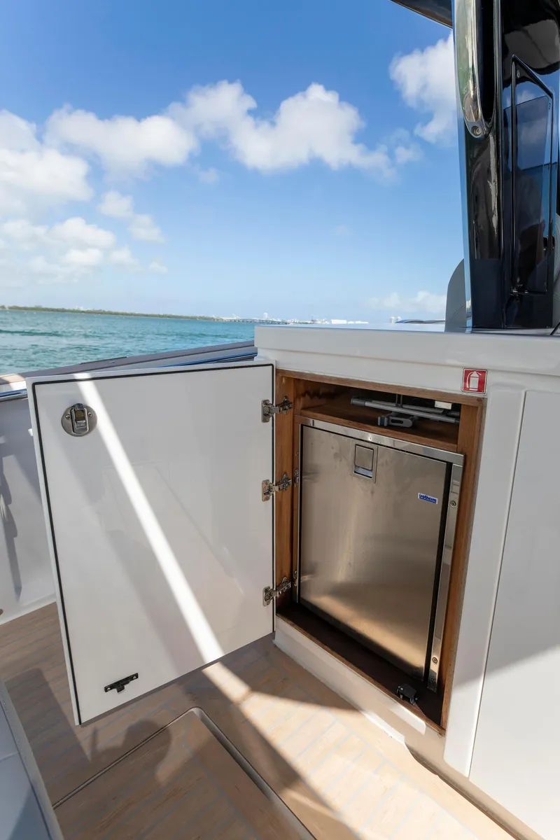 Slide: The Image of Pardo Yachts 38 (2022) with open storage compartment, ocean view, and clear sky. - 51