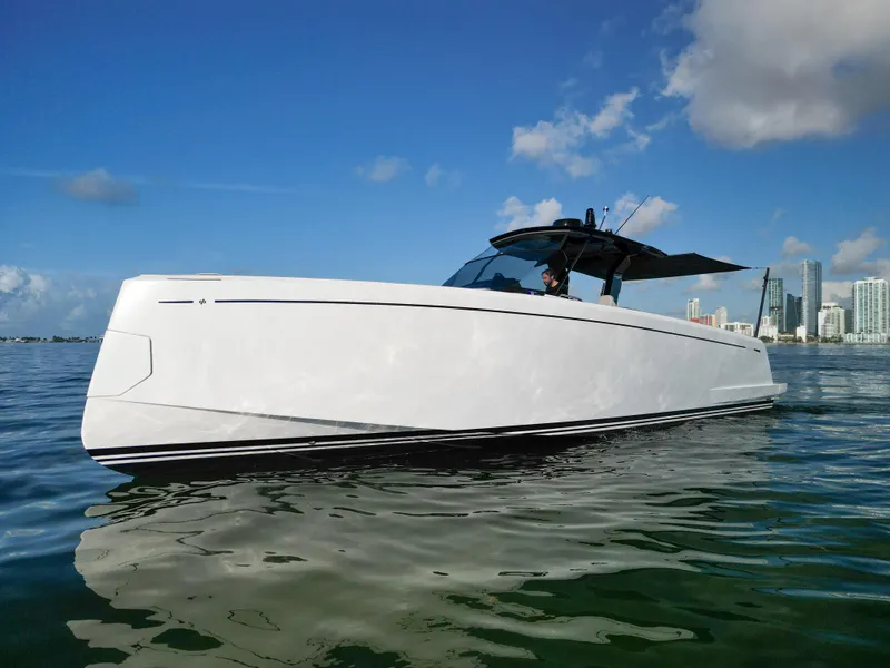 Slide: The Image of 2022 Pardo Yachts 38 cruising on calm waters with city skyline in background. - 15