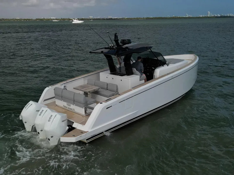 Slide: The Image of 2022 Pardo Yachts 38 cruising on open water, featuring sleek design and twin outboard engines. - 19