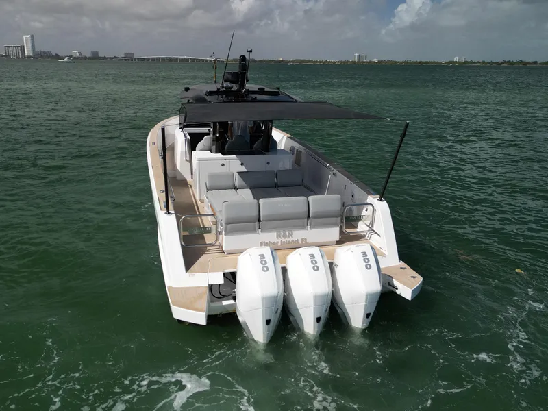 Slide: The Image of 2022 Pardo Yachts 38 with triple engines cruising on open water. - 21