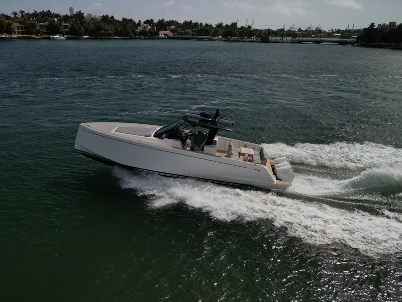 Slide: The Image of Pardo Yachts 38, 2022 model, cruising on open water with scenic background. - 39
