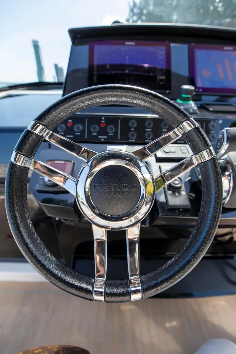 Slide: The Image of Steering wheel of 2022 Pardo Yachts 38, featuring modern dashboard controls. - 41