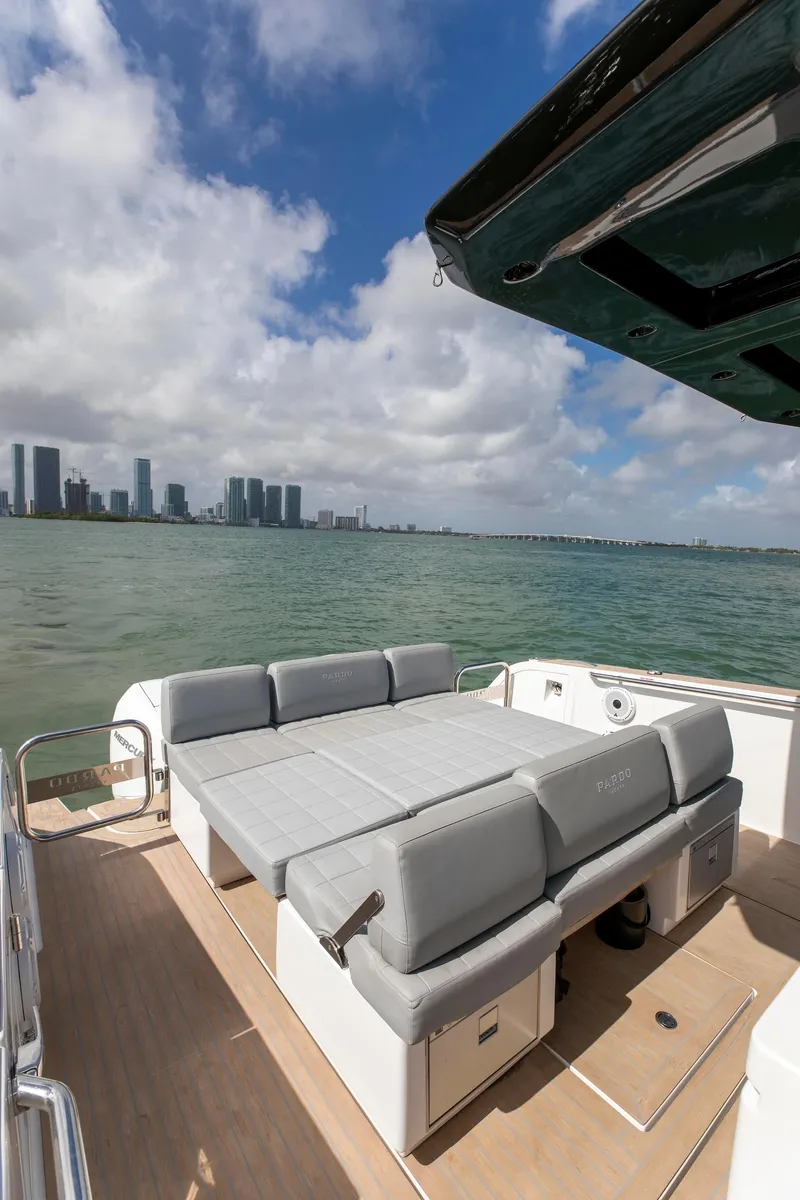 Slide: The Image of 2022 Pardo Yachts 38 with spacious deck, city skyline view, and comfortable seating. - 44