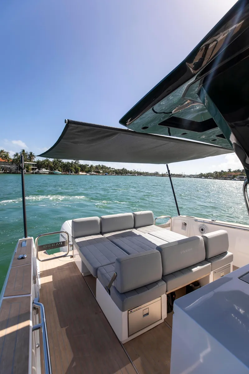Slide: The Image of 2022 Pardo Yachts 38 with sunshade, luxurious seating, and scenic ocean view. - 5