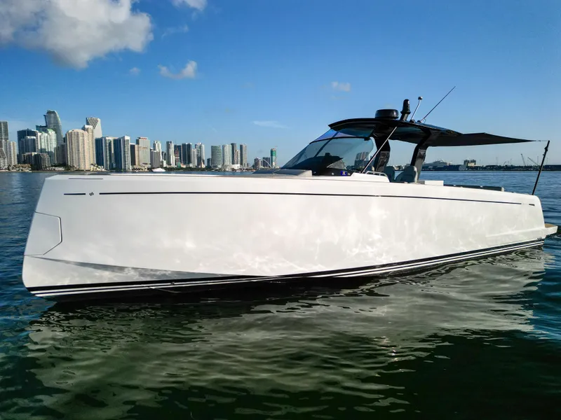 Slide: The Image of 2022 Pardo Yachts 38 cruising near a city skyline on a sunny day. - 9