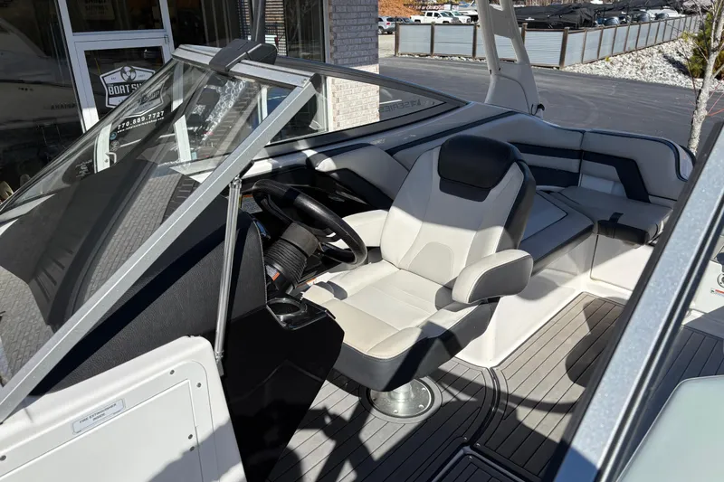 Slide: The Image of 2017 Yamaha 242 Limited SE-Series boat interior with captain's seat and steering wheel. - 11