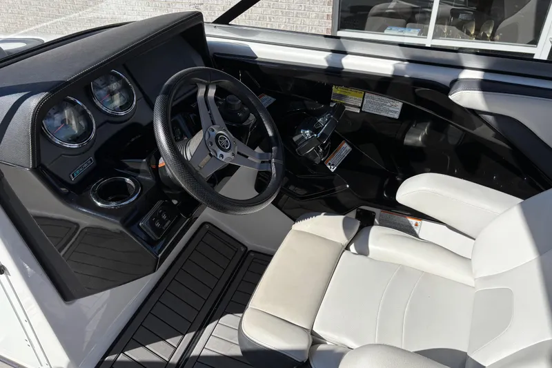 Slide: The Image of 2017 Yamaha 242 Limited SE-Series boat interior with steering wheel and dashboard controls. - 12