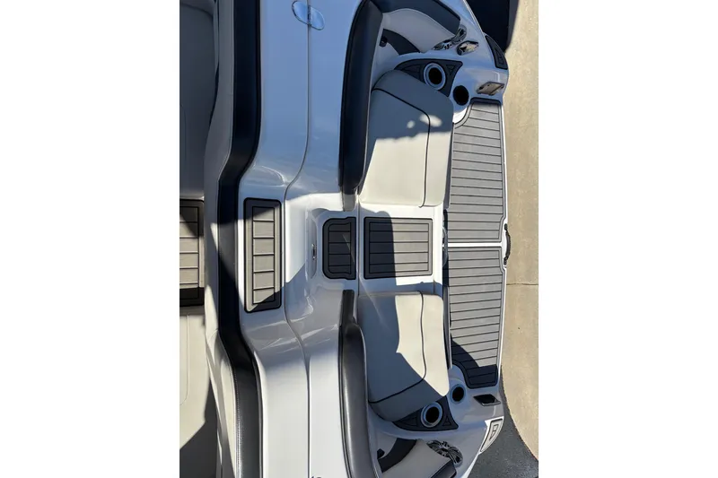 Slide: The Image of 2017 Yamaha 242 Limited SE-Series boat interior with sleek seating and cup holders. - 15