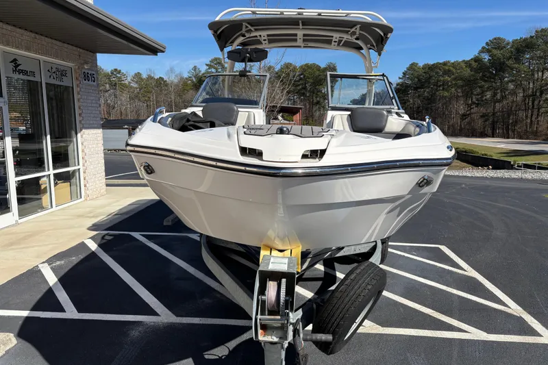 Slide: The Image of 2017 Yamaha 242 Limited SE-Series boat on trailer in parking lot. - 2