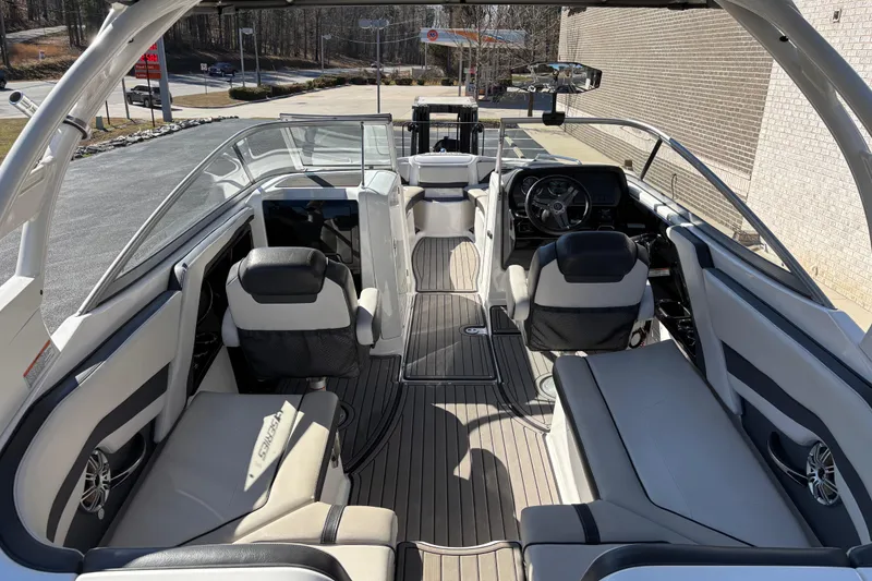 Slide: The Image of 2017 Yamaha 242 Limited SE-Series boat interior with sleek seating and modern dashboard. - 6