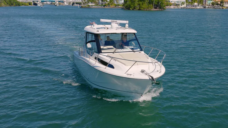 Slide: The Image of 2023 Boston Whaler 325 Conquest on open water. - 3