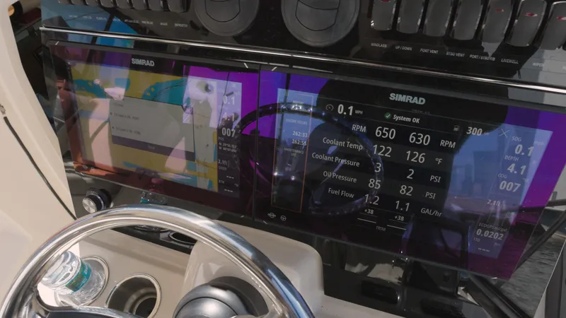 Slide: The Image of Dashboard of 2023 Boston Whaler 325 Conquest with Simrad displays. - 8