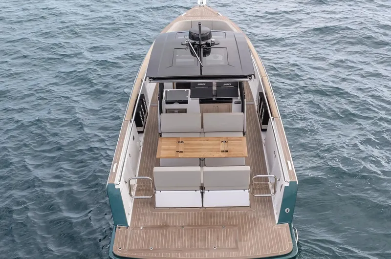 Slide: The Image of 2023 Fjord 38 boat with sleek deck design on open water. - 10