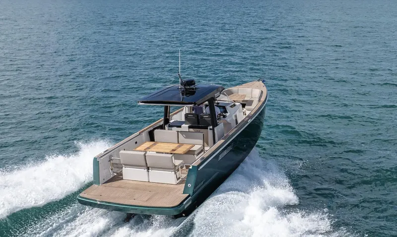 Slide: The Image of 2023 Fjord 38 motor yacht cruising on open water, showcasing sleek design and luxury features. - 11