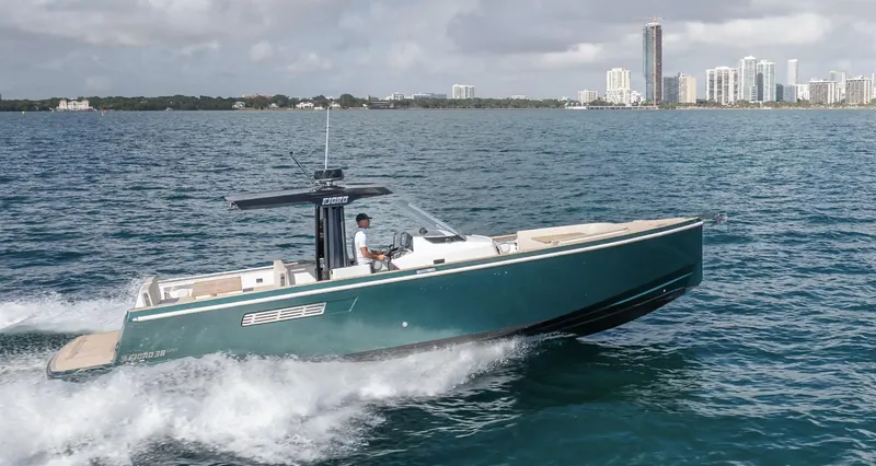 Slide: The Image of 2023 Fjord 38 boat cruising on ocean near city skyline. - 12