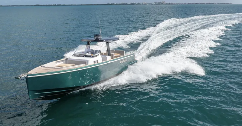 Slide: The Image of 2023 Fjord 38 yacht cruising swiftly on open water. - 13