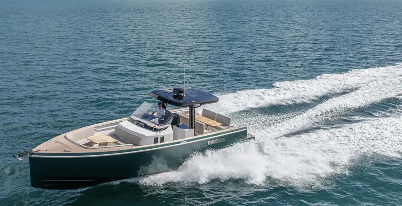 Slide: The Image of 2023 Fjord 38 boat cruising on open water, showcasing sleek design and powerful performance. - 14