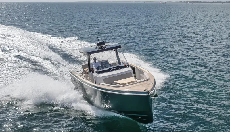 Slide: The Image of 2023 Fjord 38 boat cruising on open water, showcasing sleek design and performance. - 18