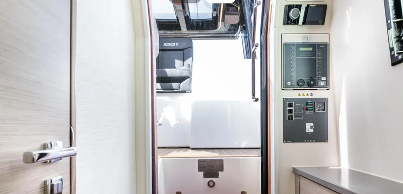 Slide: The Image of Interior view of 2023 Fjord 38 yacht, featuring control panels and modern design elements. - 30