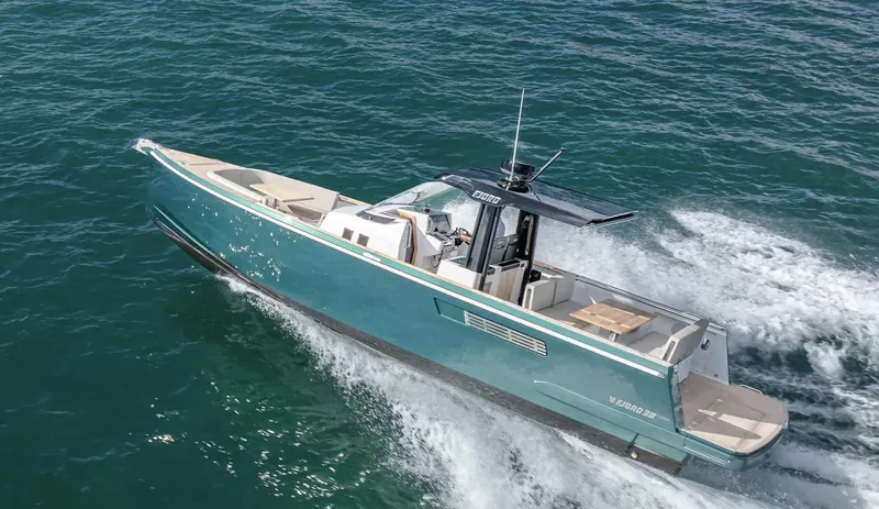 Slide: The Image of 2023 Fjord 38 motor yacht cruising on open water. - 4