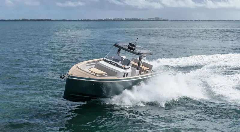 Slide: The Image of 2023 Fjord 38 boat cruising on open water, showcasing sleek design and powerful performance. - 8