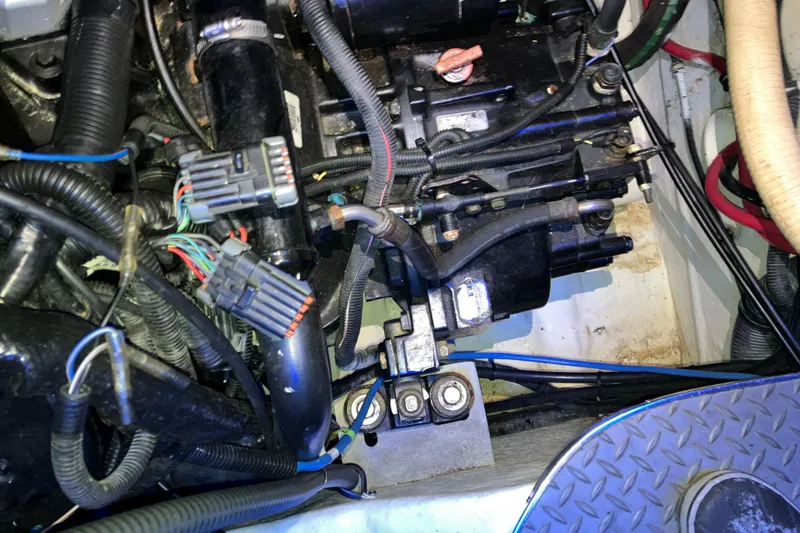 Slide: The Image of Engine compartment of a 2001 Formula 37 Performance Cruiser with visible wiring and components. - 41