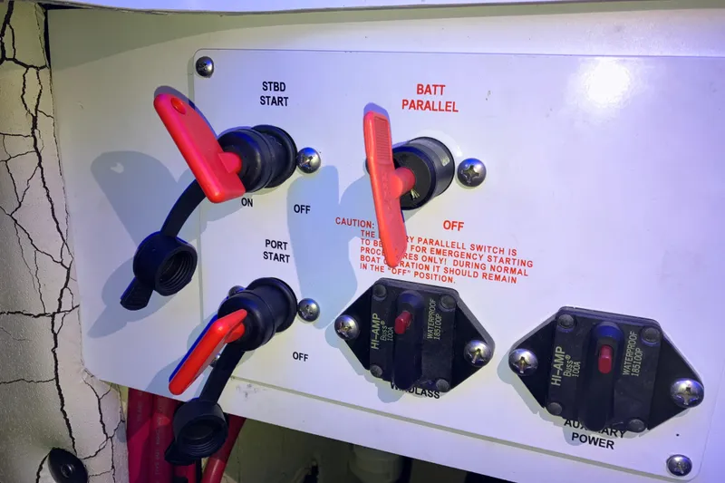 Slide: The Image of Control panel of a 2001 Formula 37 Performance Cruiser with battery switches and circuit breakers. - 49