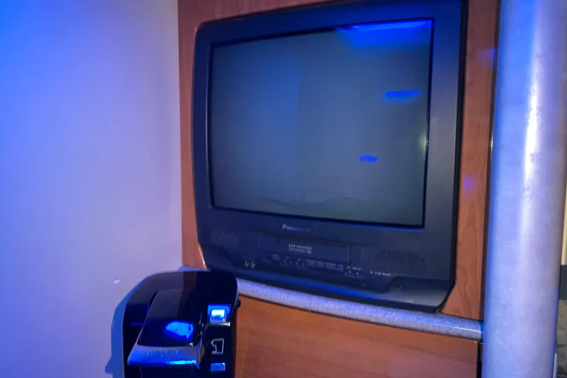 Slide: The Image of 2001 Formula 37 Performance Cruiser interior with vintage TV and coffee maker. - 39