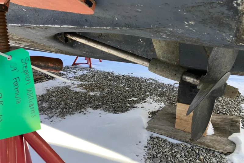 Slide: The Image of Propeller and shaft of a 2001 Formula 37 Performance Cruiser on a snowy surface. - 66