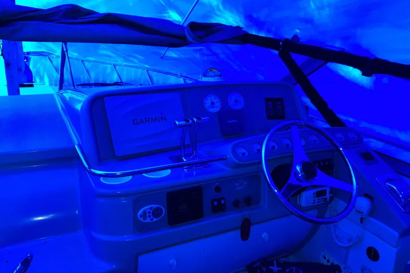 Slide: The Image of Cockpit of 2001 Formula 37 Performance Cruiser with Garmin navigation, illuminated in blue light. - 54
