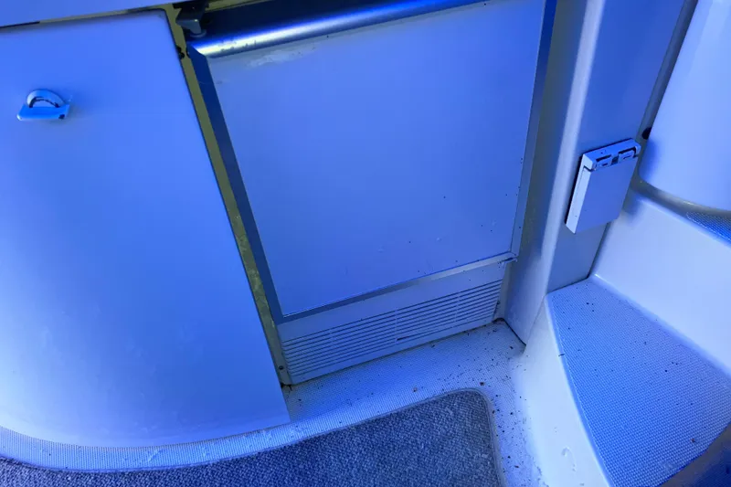 Slide: The Image of Interior of 2001 Formula 37 Performance Cruiser, featuring a compact kitchenette area. - 15